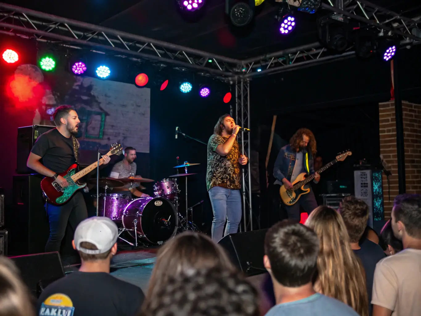 A compelling photograph of a BESP RECORDS-supported music performance, capturing the energy and excitement of the event and the connection between the performers and the audience.